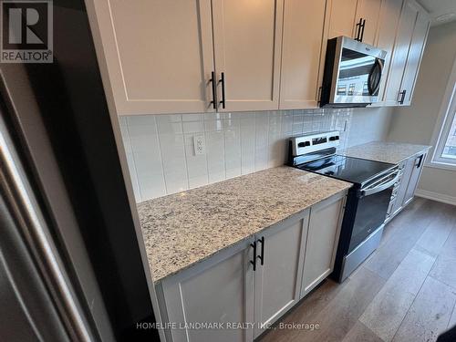 109 - 1593 Rose Way, Milton, ON - Indoor Photo Showing Kitchen With Upgraded Kitchen