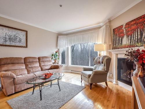 Living room - 202-101 Ch. De La Grande-Côte, Lorraine, QC - Indoor Photo Showing Living Room With Fireplace