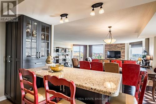 704 - 700 Wilson Road N, Oshawa (Centennial), ON - Indoor Photo Showing Dining Room With Fireplace