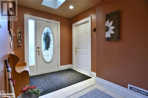 Entrance foyer with tile patterned flooring and a skylight - 97 Glen Eton Road, Wasaga Beach, ON 