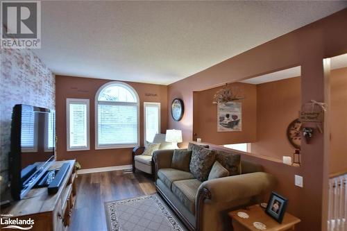 Living room featuring dark hardwood / wood-style floors - 97 Glen Eton Road, Wasaga Beach, ON 