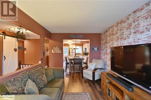 Living room with hardwood / wood-style floors and a chandelier - 97 Glen Eton Road, Wasaga Beach, ON 