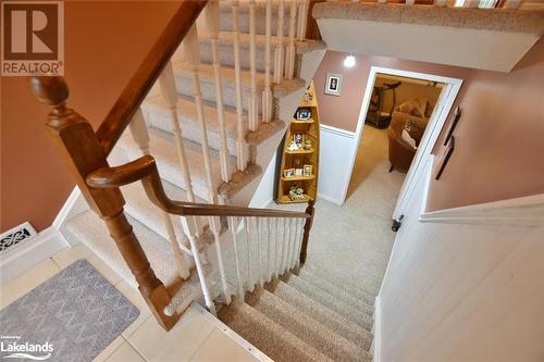 Staircase with tile patterned floors - 97 Glen Eton Road, Wasaga Beach, ON 