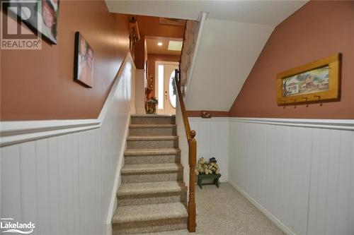 Stairway with carpet floors and lofted ceiling - 97 Glen Eton Road, Wasaga Beach, ON 