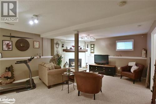 Living room with light colored carpet - 97 Glen Eton Road, Wasaga Beach, ON 