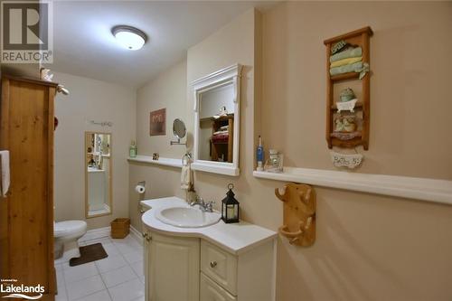 Bathroom featuring tile patterned flooring, vanity, and toilet - 97 Glen Eton Road, Wasaga Beach, ON 