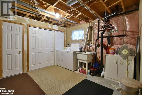 Basement with sink and washing machine and clothes dryer - 97 Glen Eton Road, Wasaga Beach, ON 