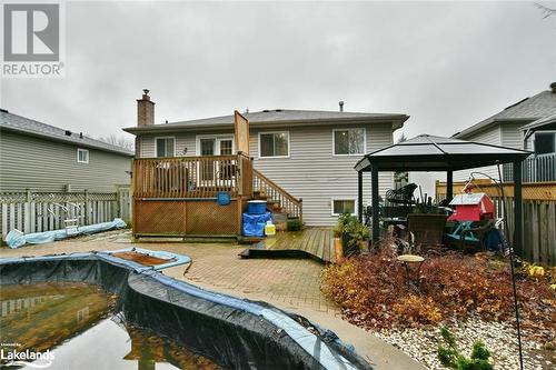 Rear view of house featuring a gazebo, a patio area, and a pool side deck - 97 Glen Eton Road, Wasaga Beach, ON 