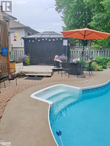 View of swimming pool with a deck and a patio area - 97 Glen Eton Road, Wasaga Beach, ON 