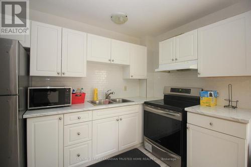 94 - 70 Fiddlers Green Road, London, ON - Indoor Photo Showing Kitchen With Double Sink