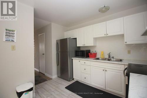 94 - 70 Fiddlers Green Road, London, ON - Indoor Photo Showing Kitchen With Double Sink