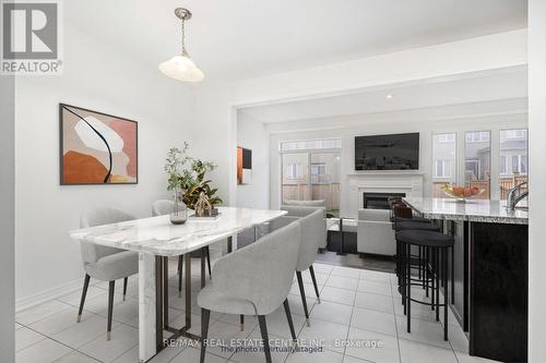 12 Heming Trail, Hamilton, ON - Indoor Photo Showing Dining Room With Fireplace