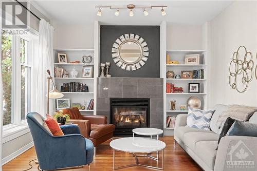 12 Queen Mary Street, Ottawa, ON - Indoor Photo Showing Living Room With Fireplace