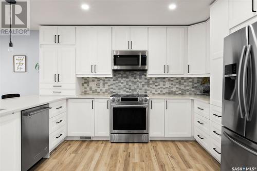 2810 More Crescent E, Regina, SK - Indoor Photo Showing Kitchen With Stainless Steel Kitchen With Upgraded Kitchen