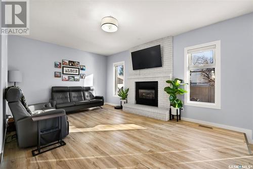 2810 More Crescent E, Regina, SK - Indoor Photo Showing Living Room With Fireplace