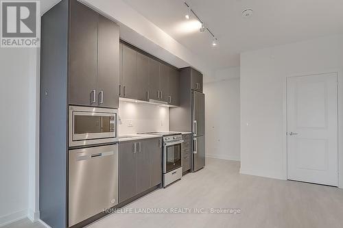 A1606 - 30 Upper Mall Way, Vaughan, ON - Indoor Photo Showing Kitchen