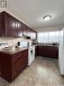 251&255 17Th Avenue Ne, Swift Current, SK  - Indoor Photo Showing Kitchen With Double Sink 