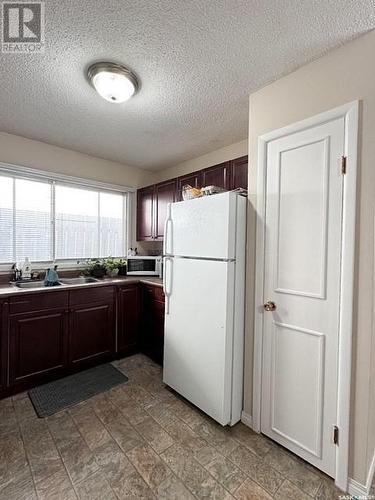 251&255 17Th Avenue Ne, Swift Current, SK - Indoor Photo Showing Kitchen With Double Sink