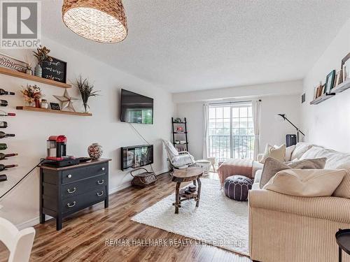 204 - 90 Aspen Springs Drive W, Clarington, ON - Indoor Photo Showing Living Room