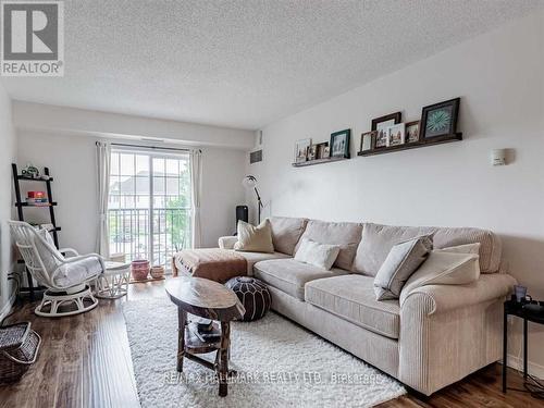 204 - 90 Aspen Springs Drive W, Clarington, ON - Indoor Photo Showing Living Room