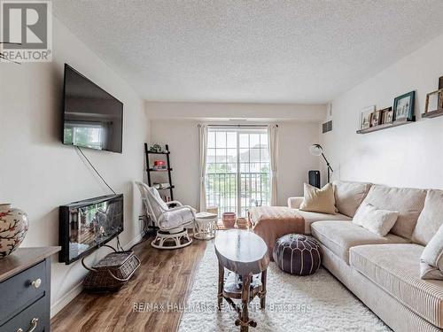 204 - 90 Aspen Springs Drive W, Clarington, ON - Indoor Photo Showing Living Room