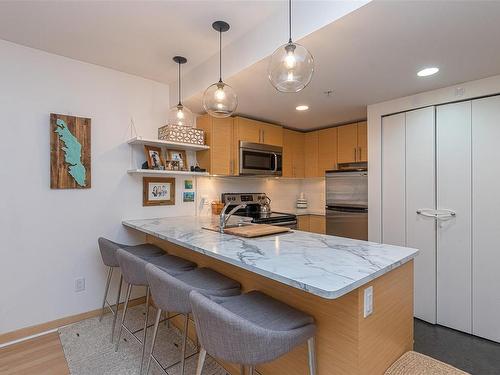 205-787 Tyee Rd, Victoria, BC - Indoor Photo Showing Kitchen With Double Sink