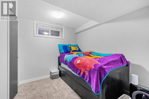 Bedroom 4, basement - 1015 Riverbend Drive Se, Calgary, AB - Indoor Photo Showing Bedroom