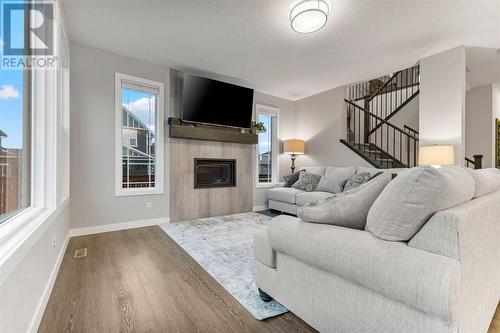 248 Sandpiper Crescent, Chestermere, AB - Indoor Photo Showing Living Room With Fireplace