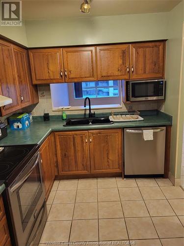 75 Riverside East Unit# 1707, Windsor, ON - Indoor Photo Showing Kitchen With Double Sink