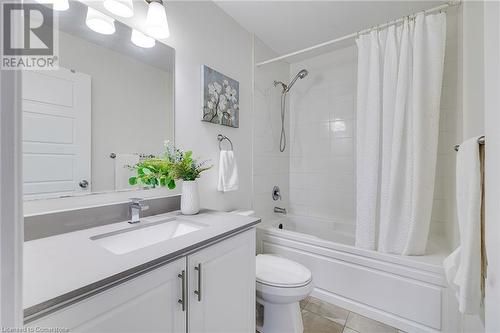 Full bathroom with tile patterned flooring, vanity, toilet, and shower / bath combo with shower curtain - 577 Goldenrod Lane, Kitchener, ON - Indoor Photo Showing Bathroom