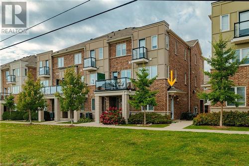 View of building exterior - 577 Goldenrod Lane, Kitchener, ON - Outdoor With Balcony With Facade