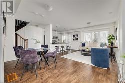 Dining space featuring wood-type flooring - 