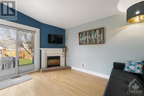 370 Duvernay Drive, Orleans - Cumberland And Area (1104 - Queenswood Heights South), ON - Indoor Photo Showing Living Room With Fireplace