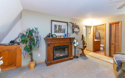 7680 Mountain Drive, Anglemont, BC - Indoor Photo Showing Living Room With Fireplace