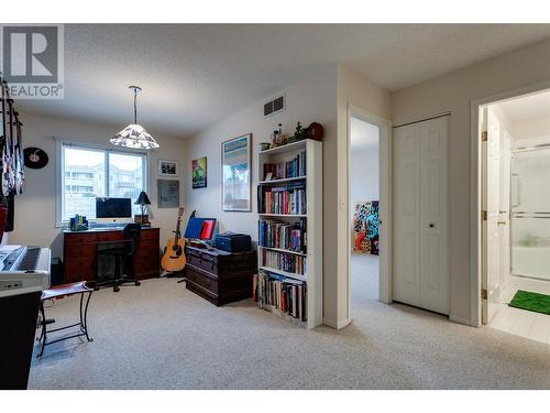 Upstairs loft / den / music room - add a wall for additional bedroom - 1675 Thayer Court Unit# 11, Kelowna, BC - Indoor