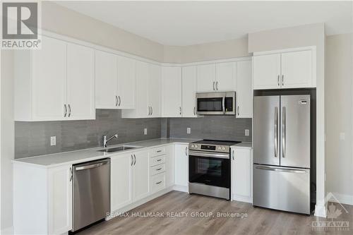 212 - 397 Codd'S Road, Ottawa, ON - Indoor Photo Showing Kitchen With Stainless Steel Kitchen With Double Sink