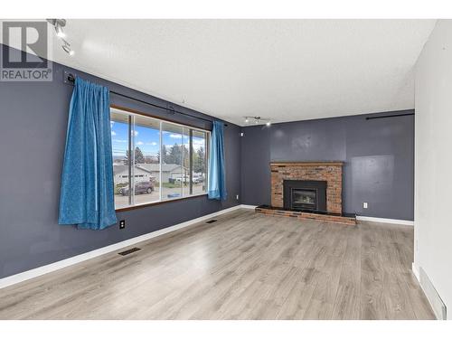 Main Floor - Livivng Room - 965 Graham Rd Road, Kelowna, BC - Indoor Photo Showing Living Room With Fireplace