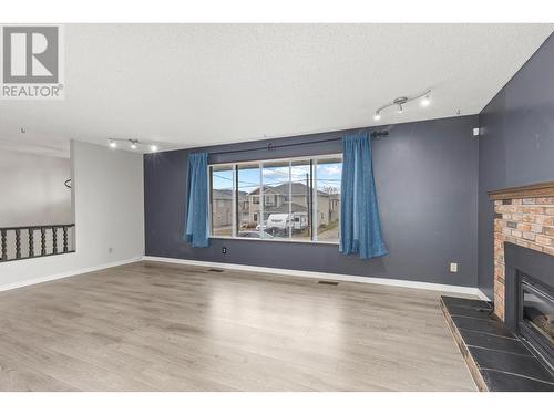 Main Floor - Living Room - 965 Graham Rd Road, Kelowna, BC - Indoor With Fireplace