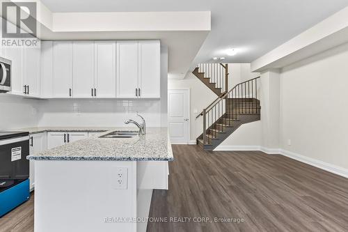 117 - 1569 Rose Way, Milton, ON - Indoor Photo Showing Kitchen With Double Sink