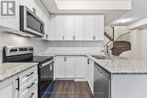 117 - 1569 Rose Way, Milton, ON - Indoor Photo Showing Kitchen With Stainless Steel Kitchen With Double Sink With Upgraded Kitchen