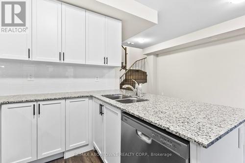 117 - 1569 Rose Way, Milton, ON - Indoor Photo Showing Kitchen With Double Sink With Upgraded Kitchen