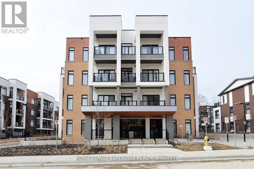 E-105 - 120 Canon Jackson Drive, Toronto, ON - Outdoor With Balcony With Facade