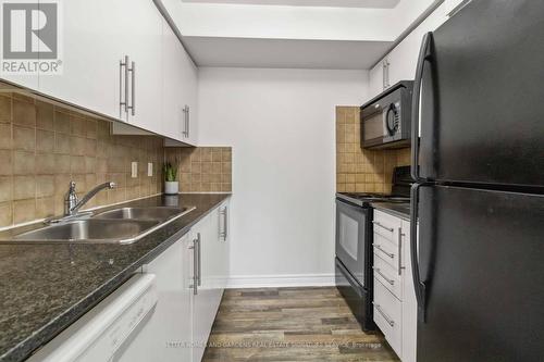 2111 - 310 Burnhamthorpe Road, Mississauga, ON - Indoor Photo Showing Kitchen With Double Sink