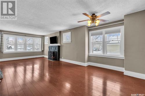 201 29Th Street W, Saskatoon, SK - Indoor Photo Showing Other Room With Fireplace