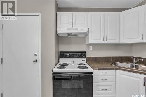 201 29Th Street W, Saskatoon, SK - Indoor Photo Showing Kitchen With Double Sink