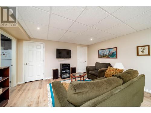 Recreation Room - 1775 Ivans Court, Kelowna, BC - Indoor Photo Showing Living Room With Fireplace