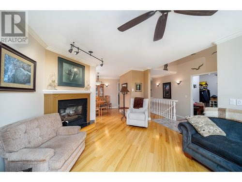 1775 Ivans Court, Kelowna, BC - Indoor Photo Showing Living Room With Fireplace