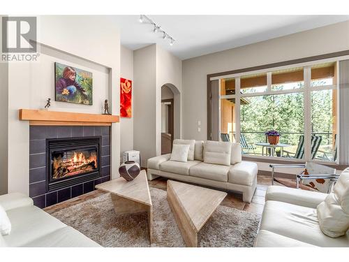 4100 Gallaghers Parkland Drive Unit# 12, Kelowna, BC - Indoor Photo Showing Living Room With Fireplace