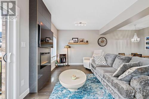 2479 Tokala Trail, London, ON - Indoor Photo Showing Living Room With Fireplace