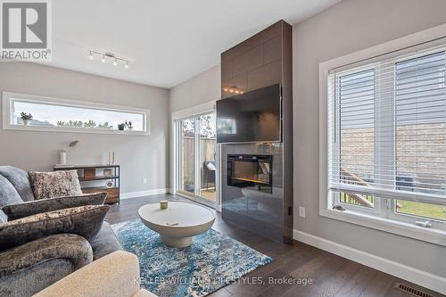 2479 Tokala Trail, London, ON - Indoor Photo Showing Living Room With Fireplace